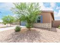 Single-story home with desert landscaping and a two-car garage at 4455 W Suncup Dr, San Tan Valley, AZ 85144