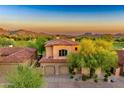 Beautiful two-story home with tile roof and three car garage at 7780 E Golden Eagle Cir, Gold Canyon, AZ 85118