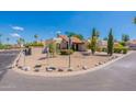 Corner lot home with a tile roof, two car garage, and desert landscaping at 14602 N Olympic Way, Fountain Hills, AZ 85268