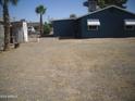 Large backyard with gravel and a shed at 875 W Douglas W Ave, Coolidge, AZ 85128