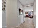 Bright entryway with tile flooring, offering a view of the living room at 40261 N La Cantera Dr, Anthem, AZ 85086