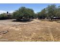 Backyard with gravel, trees, and rock border at 1522 W Fillmore St, Phoenix, AZ 85007