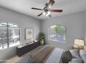 Bedroom with carpet, ceiling fan, and arched windows offering natural light at 10030 W Indian School Rd # 257, Phoenix, AZ 85037