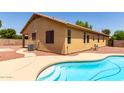 Inviting backyard pool with ample space for relaxation and entertainment at 12928 W Glenrosa Dr, Litchfield Park, AZ 85340