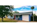 Blue house with white garage door and red front door at 1360 W 15Th St, Tempe, AZ 85281