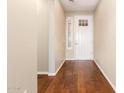 Bright entryway with hardwood floors and white door at 120 E Camellia Way, San Tan Valley, AZ 85140