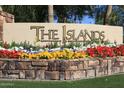 Community entrance sign for The Islands with vibrant landscaping at 1438 W Coral Reef Dr, Gilbert, AZ 85233