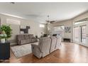 Spacious living room with two sofas and a large TV at 11225 E Ocaso Ave, Mesa, AZ 85212