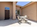 Small patio with table and chairs near the front door at 11225 E Ocaso Ave, Mesa, AZ 85212