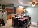 Bright kitchen with ample cabinetry and a breakfast nook at 605 N Lesueur Cir, Mesa, AZ 85203
