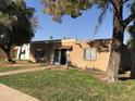 Brick home with walkway and mature trees at 605 N Lesueur Cir, Mesa, AZ 85203