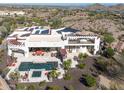 Luxury home with pool, spa, and solar panels; aerial view at 9233 S Krista E Dr, Goodyear, AZ 85338
