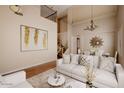 Living room with hardwood floors and high ceilings at 27780 N 90Th Ln, Peoria, AZ 85383