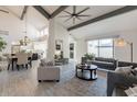 Open living room with high ceilings, exposed beams, and modern furniture at 7344 E Keim Dr, Scottsdale, AZ 85250