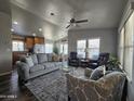 Living room with gray sofa and two armchairs at 650 N Hawes Rd # 3809, Mesa, AZ 85207