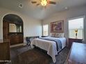 Main bedroom with large bed and en-suite bathroom at 650 N Hawes Rd # 3809, Mesa, AZ 85207