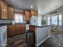 Spacious kitchen with wood cabinets and island at 650 N Hawes Rd # 3809, Mesa, AZ 85207