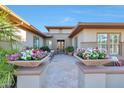 Elegant entryway with double doors and potted plants at 19232 N Cathedral Point Ct, Surprise, AZ 85387