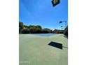 Community tennis court with green surface at 3031 N Civic Center Plz # 230, Scottsdale, AZ 85251