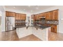 Modern kitchen with dark countertops and stainless steel appliances at 5713 W Rowel Rd, Phoenix, AZ 85083