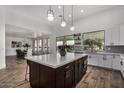 Modern kitchen with large island and open floor plan at 3130 S Valle Verde Cir, Mesa, AZ 85212