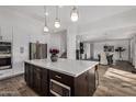 Modern kitchen with large island and open floor plan at 3130 S Valle Verde Cir, Mesa, AZ 85212