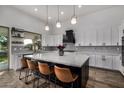 Modern kitchen with large island and stainless steel appliances at 3130 S Valle Verde Cir, Mesa, AZ 85212
