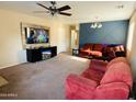 Living room with built-in entertainment center and comfortable seating at 5881 E Sunrise Cir, Florence, AZ 85132