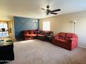 Spacious living room featuring a comfortable sectional sofa and a neutral color palette at 5881 E Sunrise Cir, Florence, AZ 85132