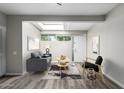 Cozy living room featuring a skylight and modern furniture at 6116 N 12Th Pl # 7, Phoenix, AZ 85014