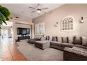 Open living room with sectional sofa, and a view into the dining area at 3856 W Links Dr, Phoenix, AZ 85086