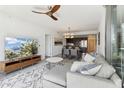 Open concept living room with modern furniture and large TV at 7180 E Kierland Blvd # 509, Scottsdale, AZ 85254