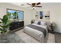 Primary bedroom with hardwood floor and large window at 8410 W Coolidge St, Phoenix, AZ 85037