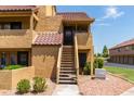 Condo building entry with stairs and landscaping at 4901 S Calle Los Cerros Dr # 267, Tempe, AZ 85282