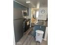 Modern kitchen with a breakfast bar and stainless steel appliances at 12123 W Bell Rd # 259, Surprise, AZ 85378