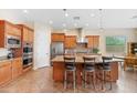 Spacious kitchen with island, stainless steel appliances, and ample cabinetry at 16205 W Berkeley Rd, Goodyear, AZ 85395