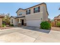 Two-story house with attached garage at 16245 W Culver St, Goodyear, AZ 85338