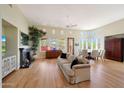 Spacious living room with hardwood floors and a fireplace at 8982 E Rusty Spur Pl, Scottsdale, AZ 85255