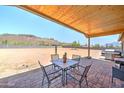 Covered patio with seating area and mountain views at 5095 N Grand Dr, Apache Junction, AZ 85120