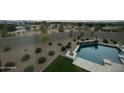 Landscaped backyard with a rectangular pool and water feature at 22752 S 226Th Pl, Queen Creek, AZ 85142