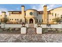 Elegant home with a brick walkway leading to a grand entrance at 21868 E Stacey Rd, Queen Creek, AZ 85142