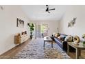 Spacious living room with a comfortable sectional sofa and access to a balcony at 7350 N Via Paseo Del Sur -- # P202, Scottsdale, AZ 85258