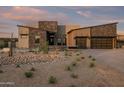 Modern home exterior with stone and stucco accents at 8332 E Sand Flower Dr # 20, Scottsdale, AZ 85266