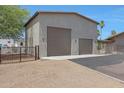 Detached two-car garage with modern design at 4452 E Lincoln Dr, Paradise Valley, AZ 85253