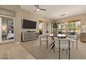 Open living room with dining area, view into bedroom and modern decor at 2989 N 44Th St # 3036, Phoenix, AZ 85018