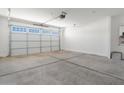 Two-car garage with an automatic door opener at 37287 W Patterson St, Maricopa, AZ 85138