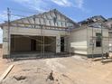 New construction home exterior, showcasing a two-car garage and modern design at 25658 N Poseidon Rd, Florence, AZ 85132