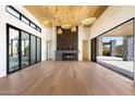 Spacious living room with hardwood floors and fireplace at 10249 E Joy Ranch Rd, Scottsdale, AZ 85262