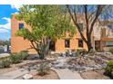 Building with stucco exterior, landscaping, and a walkway at 16844 E Ave Of The Fountains -- # 202, Fountain Hills, AZ 85268