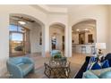 Open floor plan with sitting area and views into the wet bar at 10379 E White Feather Ln, Scottsdale, AZ 85262